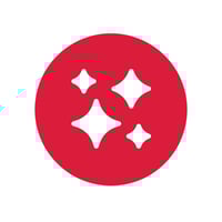 Un cercle rouge contenant quatre étincelles blanches à quatre pointes de tailles différentes, symbolisant un résultat propre et soigné.