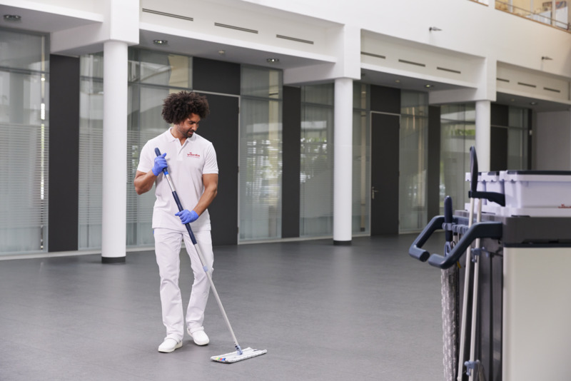 r-MicroLite_Max_Mop_Express_Pro_Frame_Telescopic_Handle_with_Gloves_mopping_floor_in_use